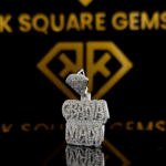 The GemKing Round Moissanite Hip Hop Pendant features a 1.65 Ct VVS1 Moissanite diamond in 925 sterling silver
