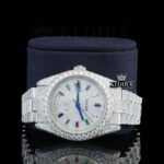 Day Date Display Rainbow Stick Markers Dial Full Iced Out Moissanite Watch Close Up Front View