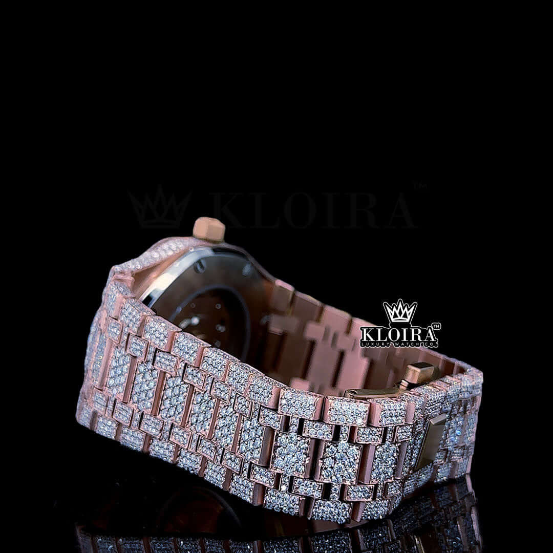 Rose gold fully iced out watch with moissanite diamonds and intricate bracelet design.