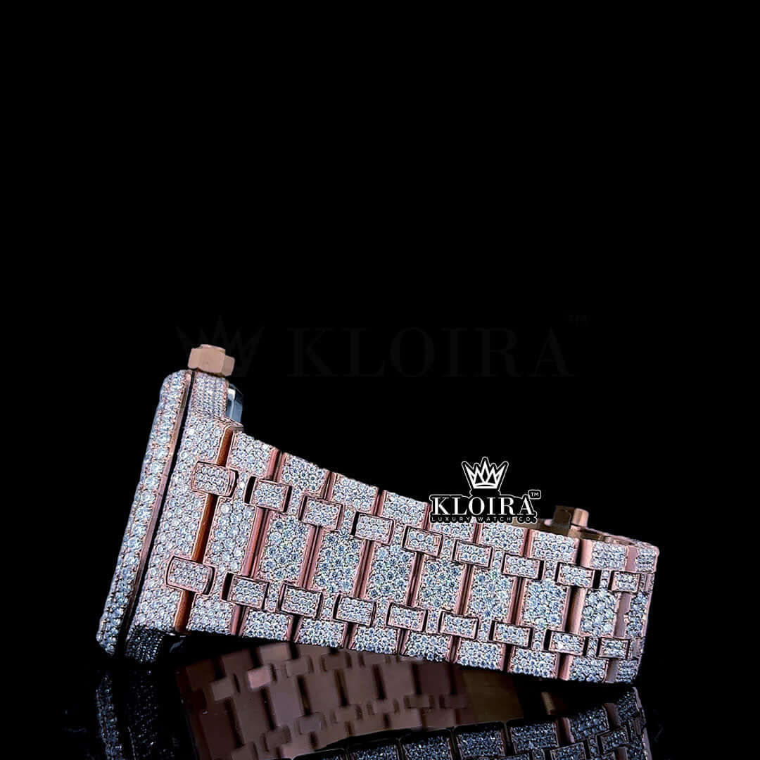 Rose gold fully iced out watch bracelet featuring moissanite gems on a glossy black background.