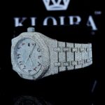 Fully Iced Out Red Arabic Numerals White Dial Moissanite Watch Left Profile View