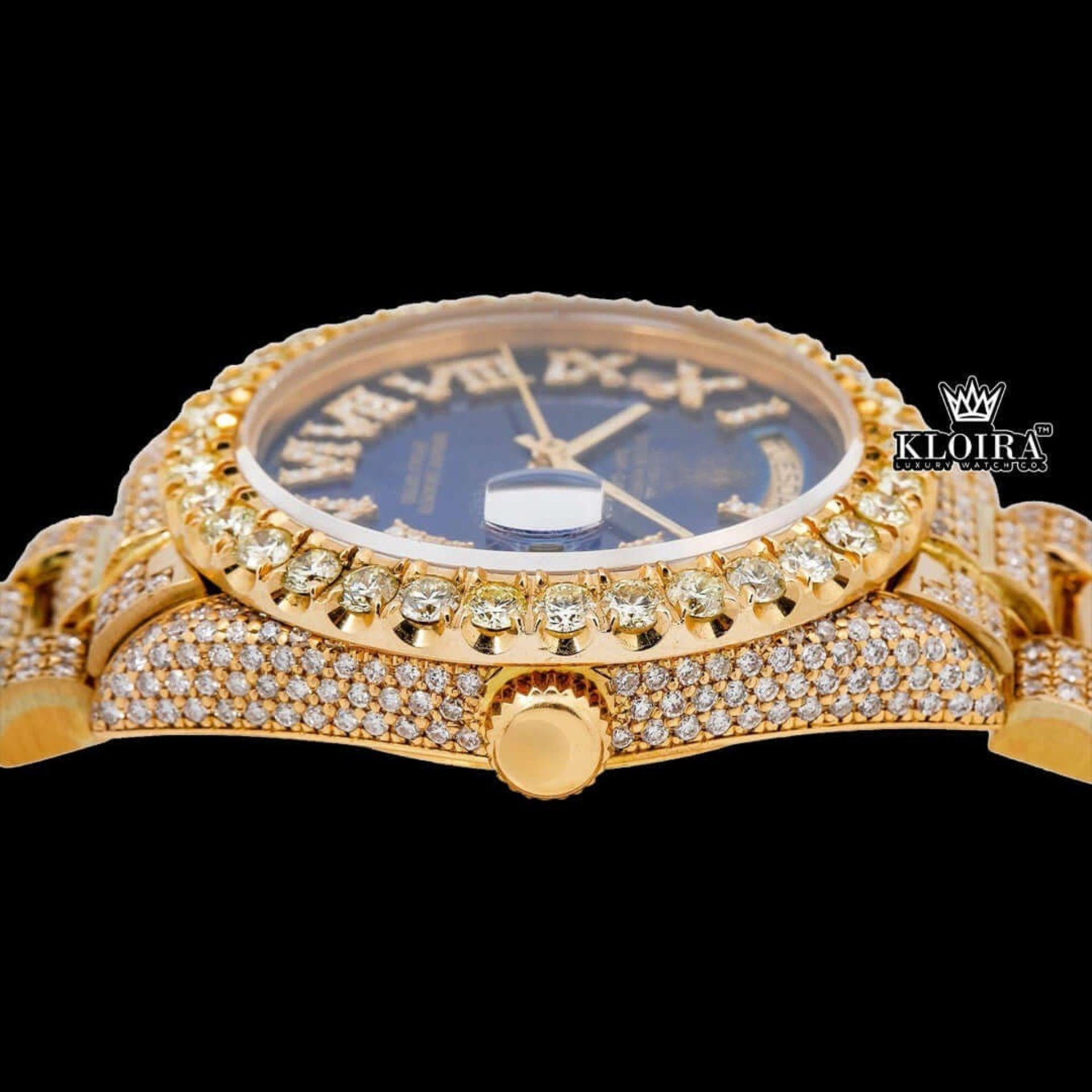 Gold Tone Blue Roman Dial Day Date Display Iced Out Moissanite Watch Crown View